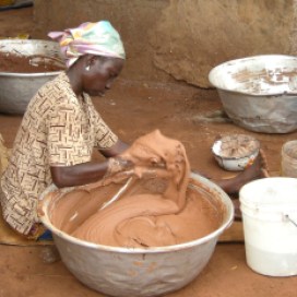 Once the nuts have been roasted, crushed and boiled, women knead the mixture for hours as it cools in order to bring the butter to the surface.